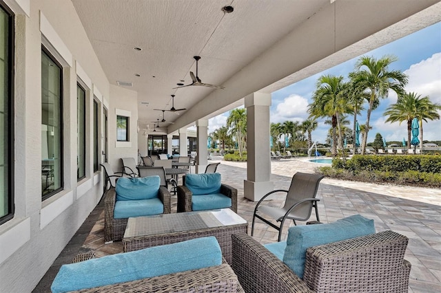 view of patio with outdoor lounge area and ceiling fan