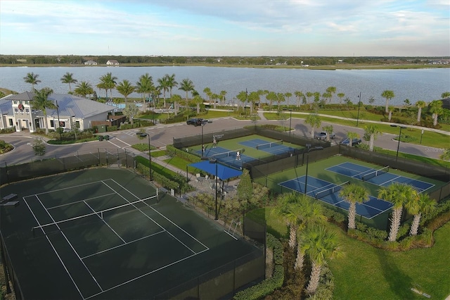 birds eye view of property with a water view