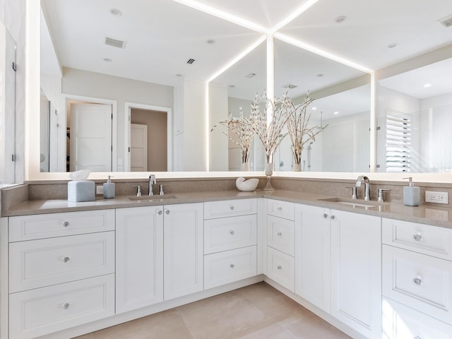 bathroom featuring tile patterned floors and vanity