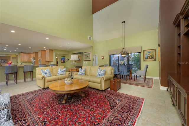 tiled living room featuring a towering ceiling