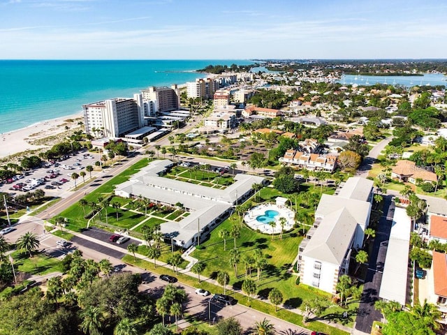 drone / aerial view featuring a view of the beach and a water view