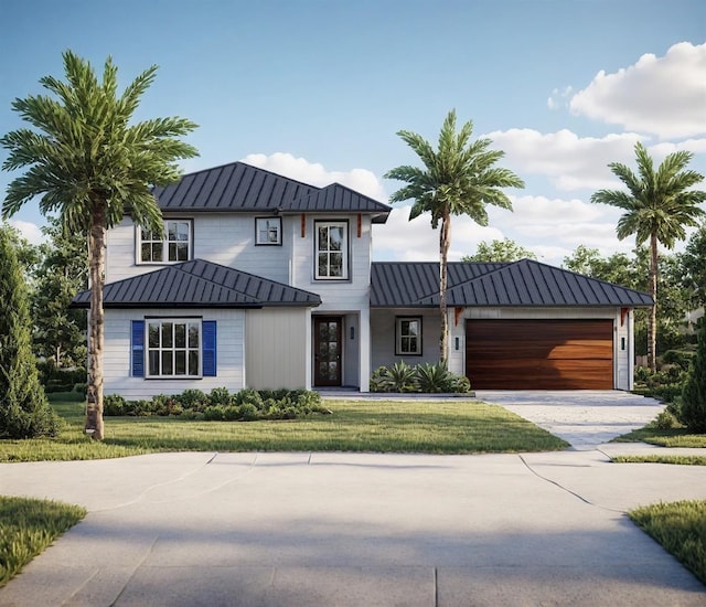 view of front of property with a garage and a front lawn