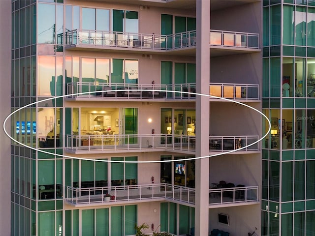 view of outdoor building at dusk