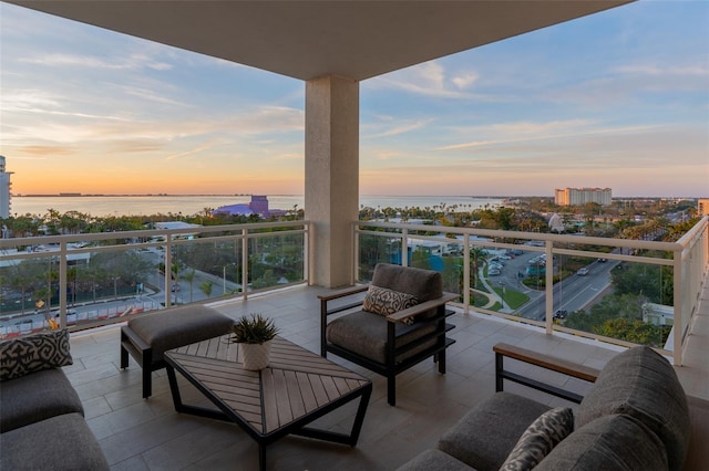 balcony at dusk with a water view