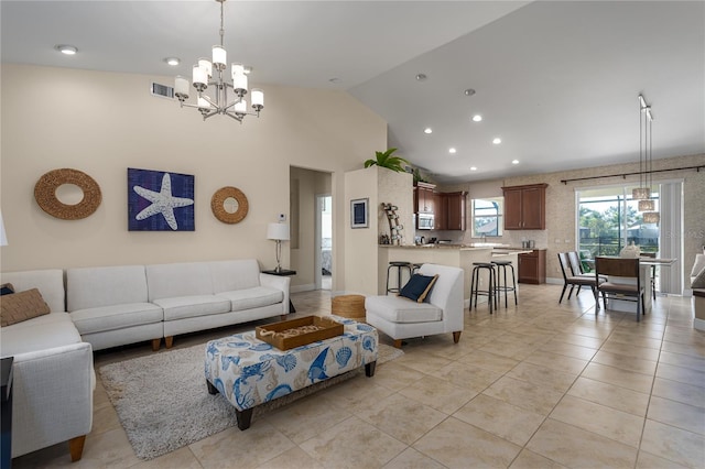 tiled living room with an inviting chandelier and lofted ceiling