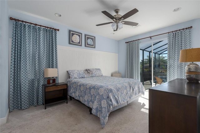 bedroom with light colored carpet, access to exterior, and ceiling fan