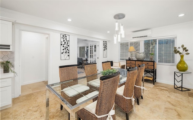 dining area with crown molding, a wall mounted air conditioner, and an inviting chandelier