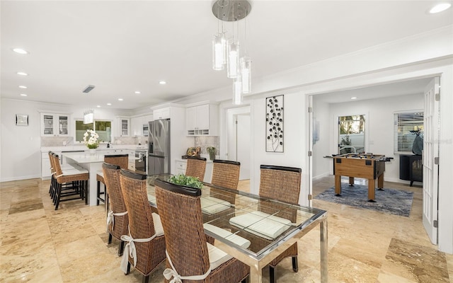 dining space featuring ornamental molding