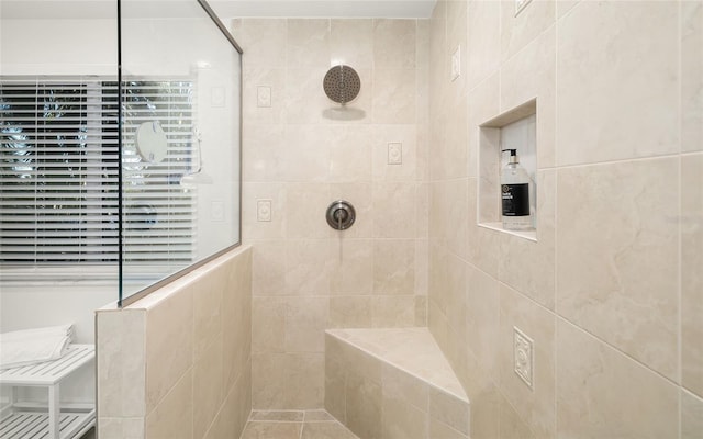 bathroom featuring tiled shower