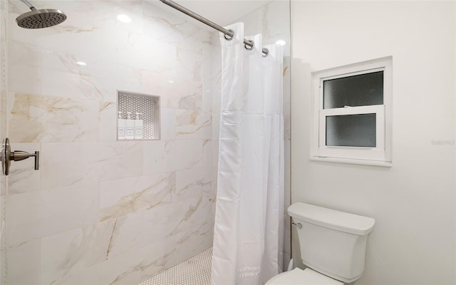 bathroom with toilet and curtained shower