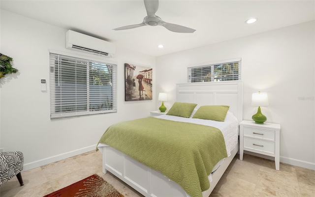 bedroom with a wall mounted air conditioner and ceiling fan