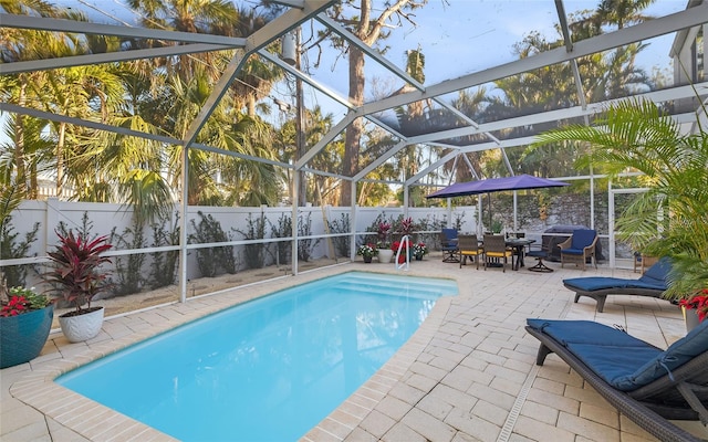 view of pool featuring a lanai and a patio area