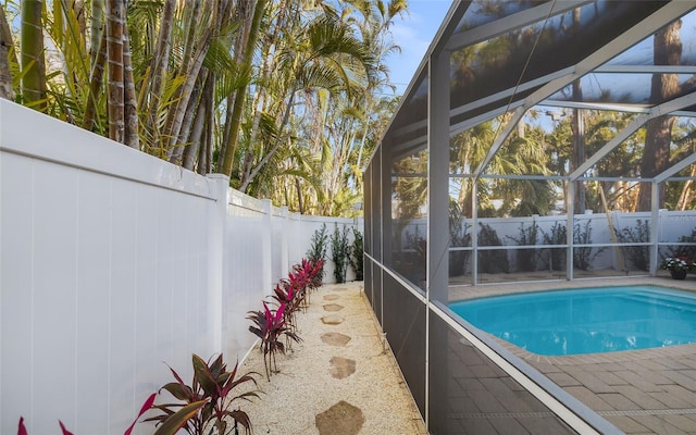 view of pool featuring a lanai and a patio area