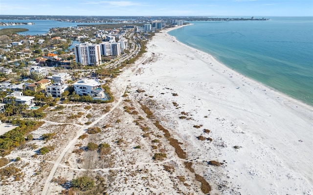 birds eye view of property with a beach view and a water view