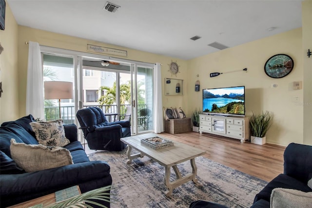 living room with light hardwood / wood-style flooring