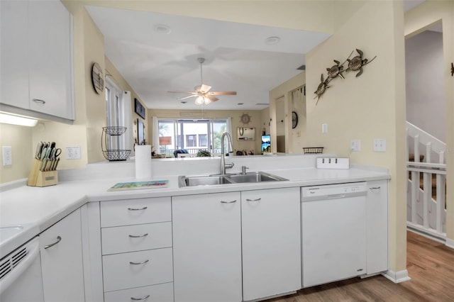 kitchen featuring sink, light hardwood / wood-style flooring, dishwasher, ceiling fan, and white cabinets