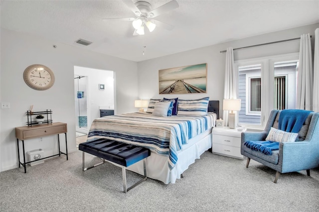 carpeted bedroom featuring a textured ceiling and ceiling fan