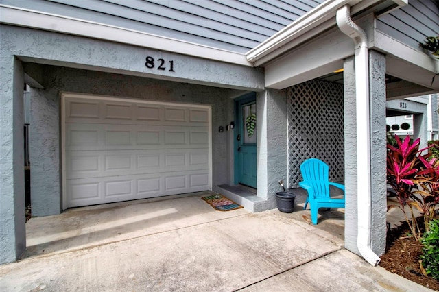 doorway to property featuring a garage