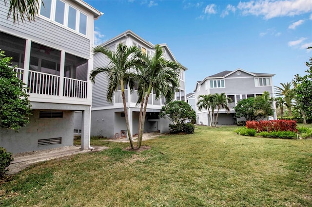 view of yard featuring a sunroom