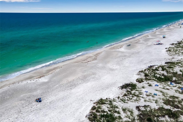 aerial view featuring a water view and a beach view