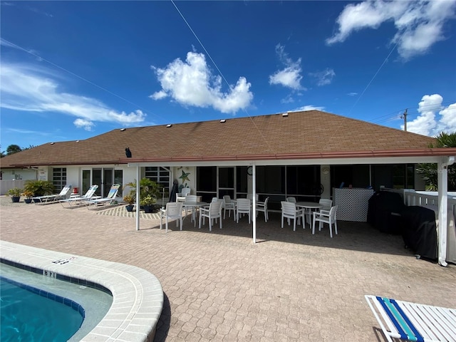 rear view of property featuring a patio