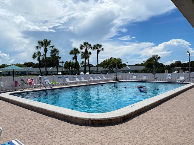 view of pool featuring a patio