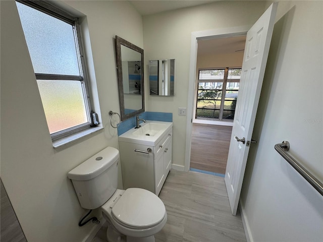 3813 42nd St W Unit 37, Bradenton, FL 34205 - bathroom featuring toilet, vanity, and baseboards