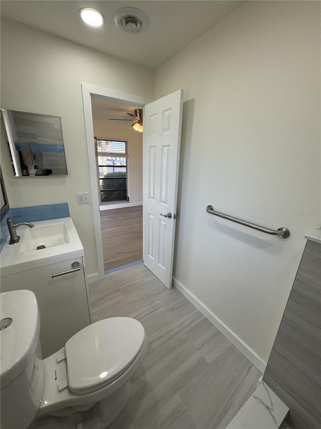 3813 42nd St W Unit 37, Bradenton, FL 34205 - bathroom featuring vanity, ceiling fan, and wood finished floors