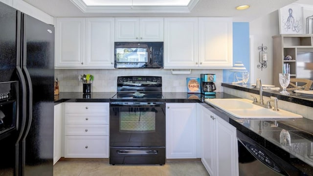 kitchen featuring white cabinetry, sink, decorative backsplash, and black appliances