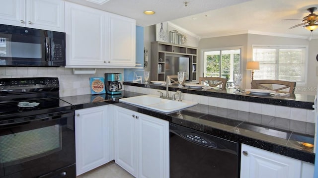 kitchen with white cabinetry, sink, decorative backsplash, ornamental molding, and black appliances