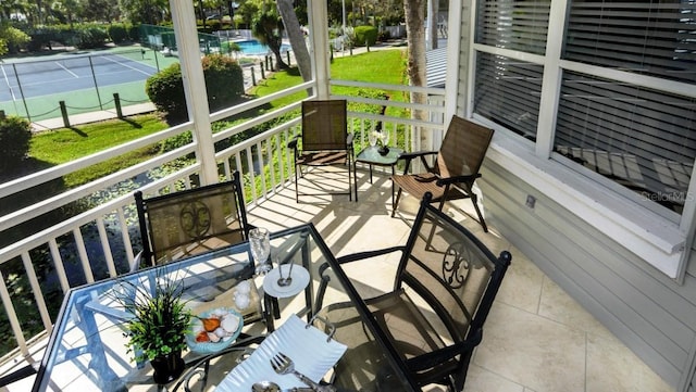 balcony featuring tennis court