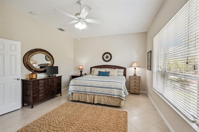 tiled bedroom with ceiling fan