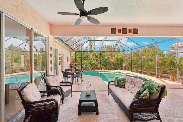 view of swimming pool featuring an outdoor living space, a lanai, and a patio