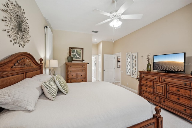 carpeted bedroom with ceiling fan and connected bathroom