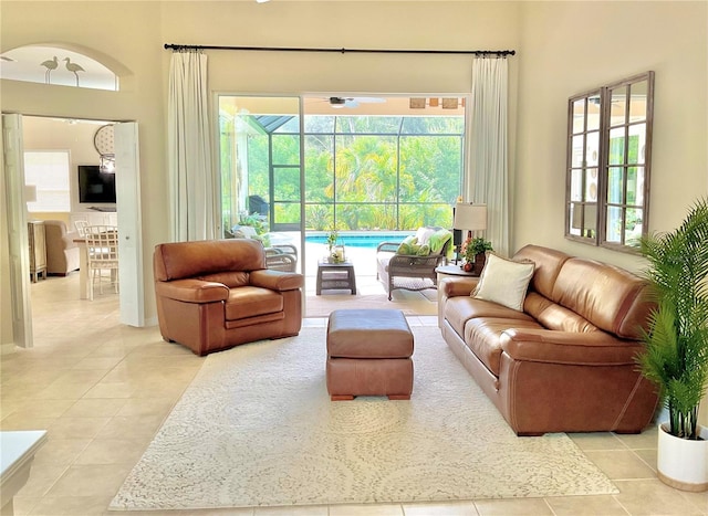 sitting room with tile patterned flooring and a sunroom