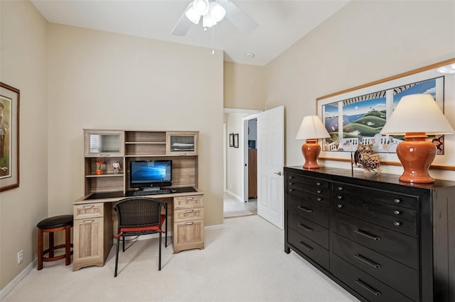 office with light carpet, a ceiling fan, and baseboards