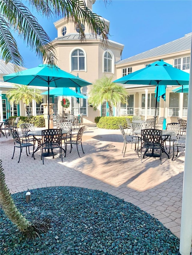 surrounding community featuring a patio area