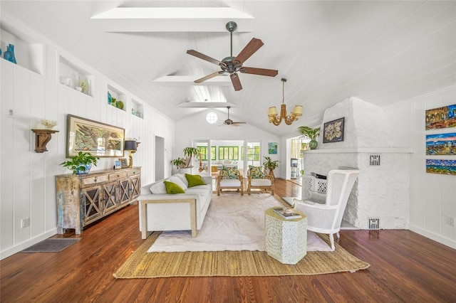 living room with dark wood-type flooring, high vaulted ceiling, a fireplace, and ceiling fan with notable chandelier