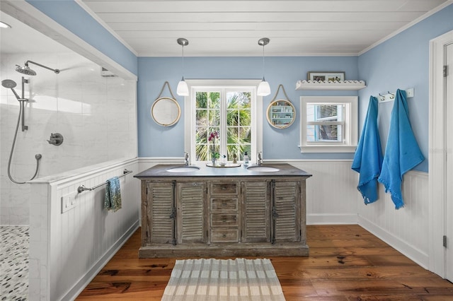 bathroom featuring vanity, crown molding, and wood-type flooring