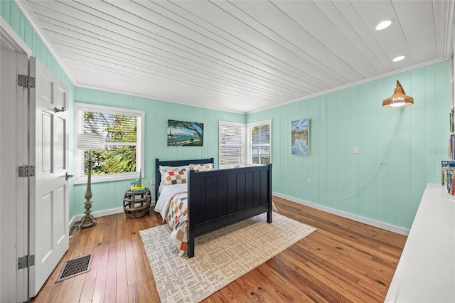 bedroom with wood-type flooring