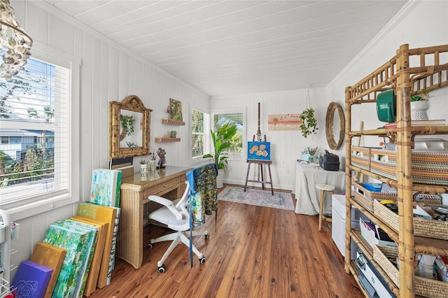 home office featuring crown molding and dark hardwood / wood-style floors