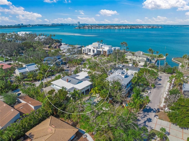 birds eye view of property with a water view