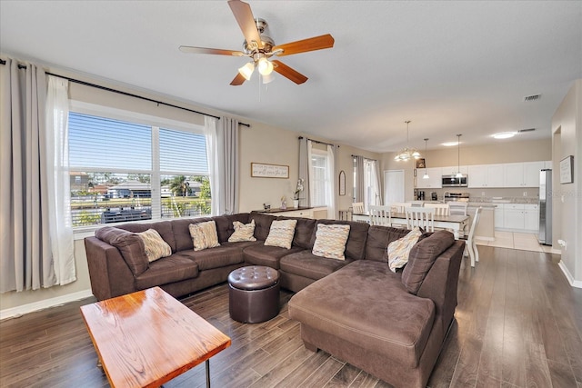 living room featuring ceiling fan and wood-type flooring