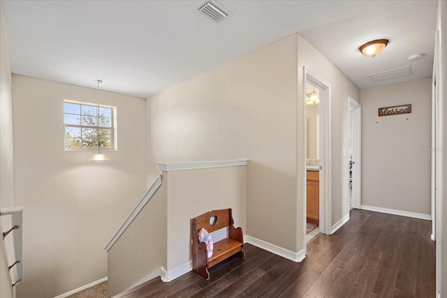 hallway featuring dark hardwood / wood-style flooring