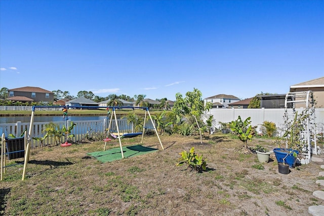 view of play area with a water view