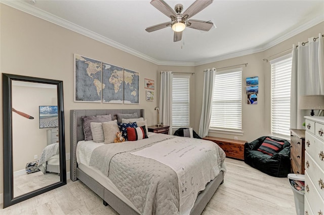 bedroom featuring crown molding, ceiling fan, and light wood-type flooring