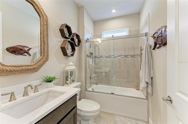 full bathroom with vanity, tile patterned flooring, enclosed tub / shower combo, and toilet