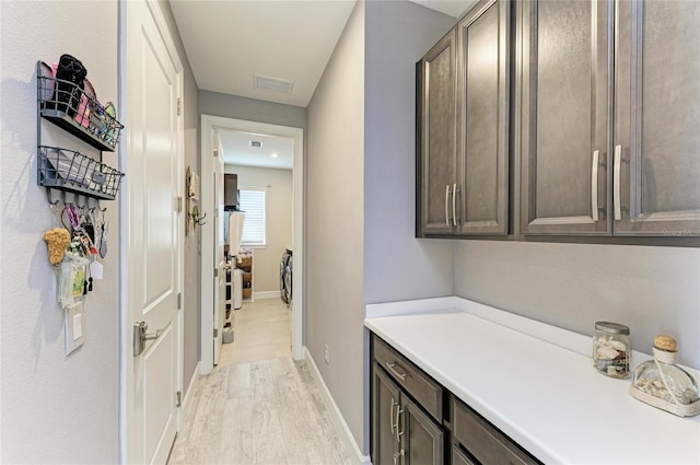 hall with light hardwood / wood-style flooring