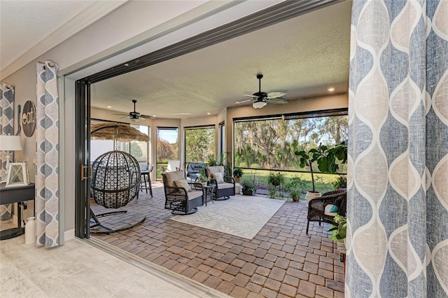 view of patio featuring an outdoor hangout area and ceiling fan