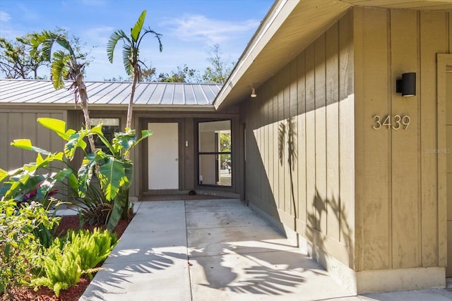 doorway to property with a patio area